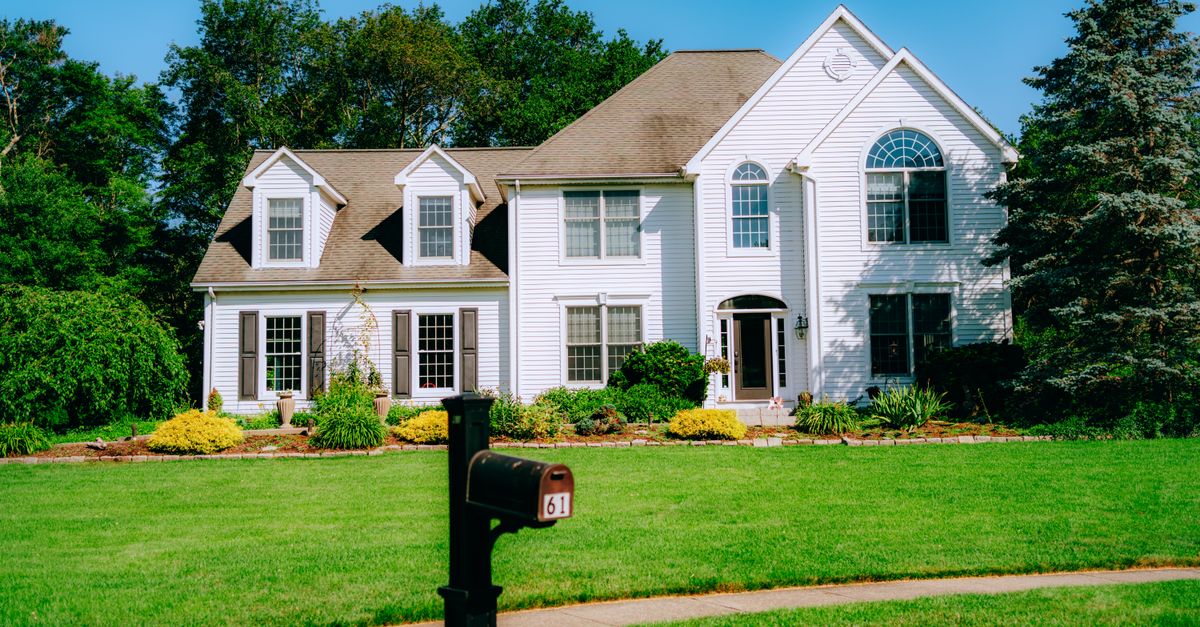 A well-maintained suburban home with a clean, green lawn